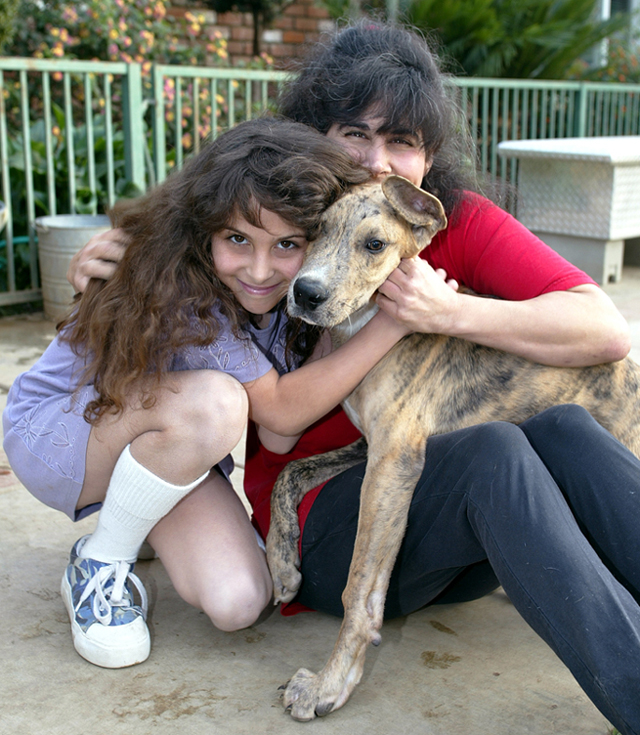 Tracy and Melody cuddle with Cougar